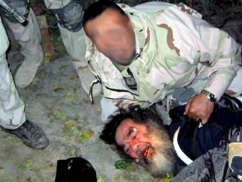 Saddam Hoessein wordt uit zijn schuilplaats gehaald (13 december 2003)
